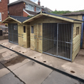 Load image into Gallery viewer, Apex Wooden Dog Kennel & Run. The pressure-treated outdoor shelter features a classic apex roof design and a secure galvanized steel run panel.