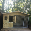 Load image into Gallery viewer, Apex Wooden Dog Kennel & Run. The pressure-treated outdoor shelter features a classic apex roof design and a secure galvanized steel run panel.