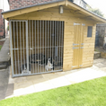 Load image into Gallery viewer, Apex Wooden Dog Kennel & Run. The pressure-treated outdoor shelter features a classic apex roof design and a secure galvanized steel run panel.