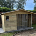 Load image into Gallery viewer, Apex Wooden Dog Kennel & Run. The pressure-treated outdoor shelter features a classic apex roof design and a secure galvanized steel run panel.