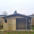 Load image into Gallery viewer, Apex Wooden Dog Kennel & Run. The pressure-treated outdoor shelter features a classic apex roof design and a secure galvanized steel run panel.