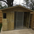 Load image into Gallery viewer, A close-up shot of the apex roof on the 8x4 Elworth dog kennel, highlighting its weatherproof design and ability to shed rain.