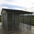 Load image into Gallery viewer, A multi-unit wooden dog kennel block with multiple runs. The structure is built with pressure-treated timber and features galvanized steel bar panels for the runs, with each unit having a separate, enclosed sleeping area. The kennel is designed for multiple dogs and is durable and secure.