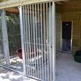 Load image into Gallery viewer, A multi-unit wooden dog kennel block with multiple runs. The structure is built with pressure-treated timber and features galvanized steel bar panels for the runs, with each unit having a separate, enclosed sleeping area. The kennel is designed for multiple dogs and is durable and secure.