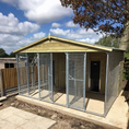 Load image into Gallery viewer, A multi-unit wooden dog kennel block with multiple runs. The structure is built with pressure-treated timber and features galvanized steel bar panels for the runs, with each unit having a separate, enclosed sleeping area. The kennel is designed for multiple dogs and is durable and secure.