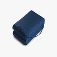 Load image into Gallery viewer, Trojan fold away dog bed in blue - compact folded with carry handle