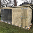 Load image into Gallery viewer, Chesterfield dog kennel installed in residential garden setting
