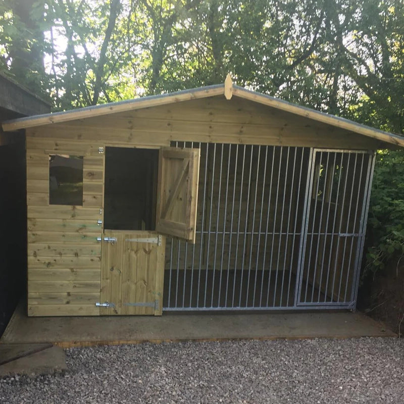 A Kennelstore 10x4 Elworth Apex Wooden Dog Kennel & Run. The pressure-treated outdoor shelter features a classic apex roof design and a secure galvanized steel run panel.