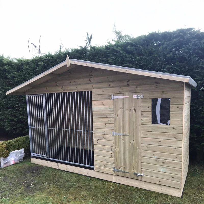 A Kennelstore 10x4 Elworth Apex Wooden Dog Kennel & Run. The pressure-treated outdoor shelter features a classic apex roof design and a secure galvanized steel run panel.