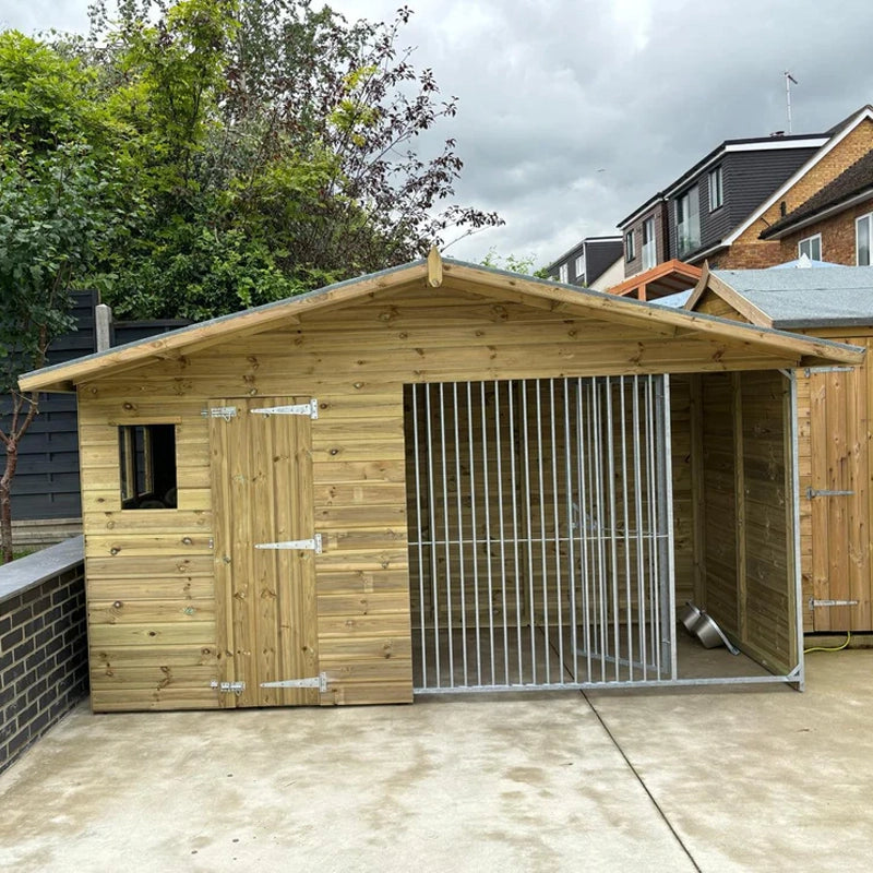 A Kennelstore 10x5 Elworth Apex Wooden Dog Kennel & Run. The pressure-treated outdoor shelter features a classic apex roof design and a secure galvanized steel run panel.