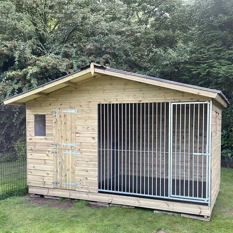 A Kennelstore 12x4 Elworth Apex Wooden Dog Kennel & Run. The pressure-treated outdoor shelter features a classic apex roof design and a secure galvanized steel run panel.
