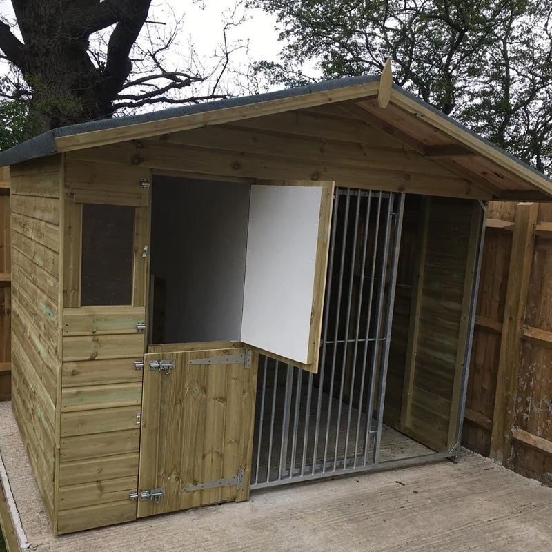 A Kennelstore 8x6 Elworth Apex Wooden Dog Kennel & Run. The pressure-treated outdoor shelter features a classic apex roof design and a secure galvanized steel run panel.