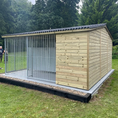Load image into Gallery viewer, A multi-unit wooden dog kennel block with multiple runs. The structure is built with pressure-treated timber and features galvanized steel bar panels for the runs, with each unit having a separate, enclosed sleeping area. The kennel is designed for multiple dogs and is durable and secure.
