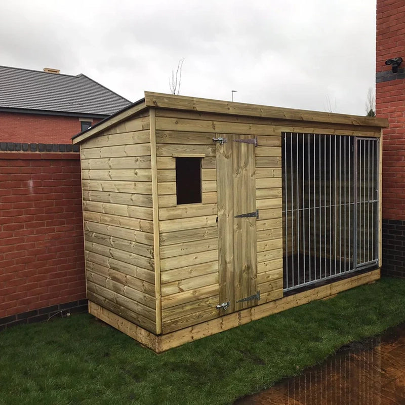 A Kennelstore 10x4 Stapeley Wooden Dog Kennel & Run. The pressure-treated outdoor shelter features a durable timber frame, a secure galvanized steel run, and a pent roof designed to shed rain.