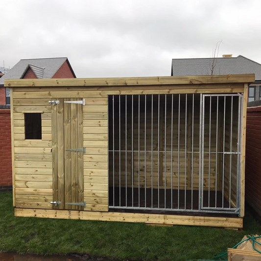 A Kennelstore 10x4 Stapeley Wooden Dog Kennel & Run. The pressure-treated outdoor shelter features a durable timber frame, a secure galvanized steel run, and a pent roof designed to shed rain.