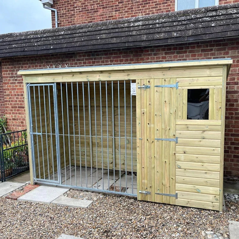 A Kennelstore 8x4 Stapeley Wooden Dog Kennel & Run. The pressure-treated outdoor shelter features a durable timber frame, a secure galvanized steel run, and a pent roof designed to shed rain.