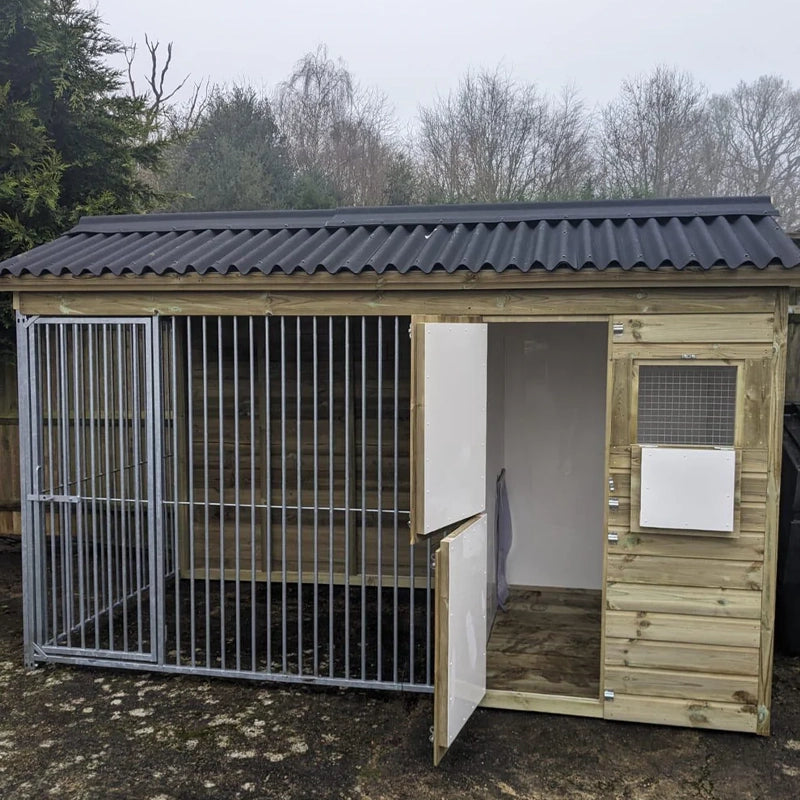 A Kennelstore 12x5 Wymbury Wooden Dog Kennel and Run. The spacious outdoor shelter is built with durable timber to provide a secure and comfortable home for a dog.